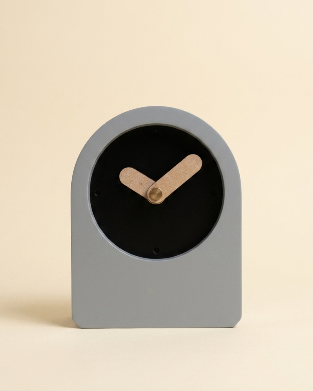 Gray clock with wooden hands on a beige background