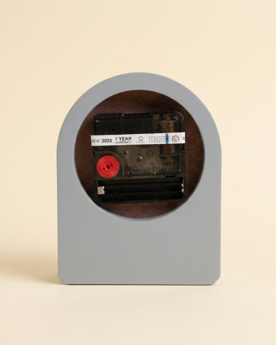 Cassette tape with a label inside a gray frame on a beige background