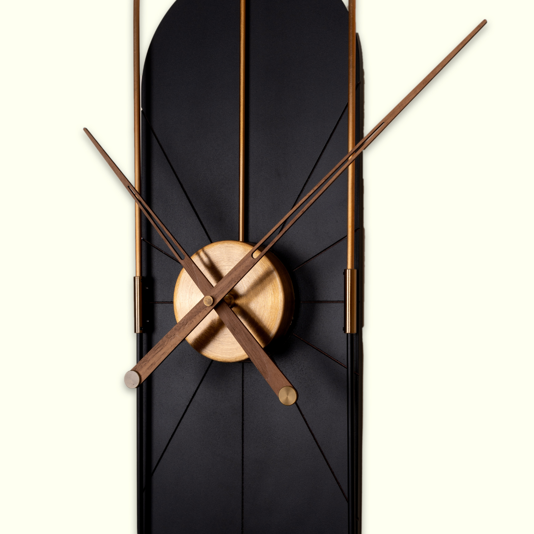 black capsule shaped wall clock